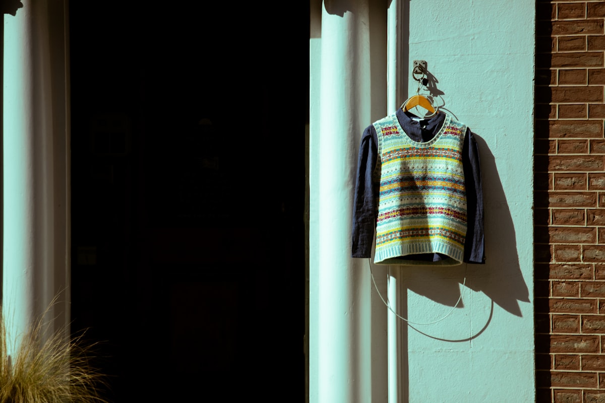 Knit vest hanging on a millhouse wall